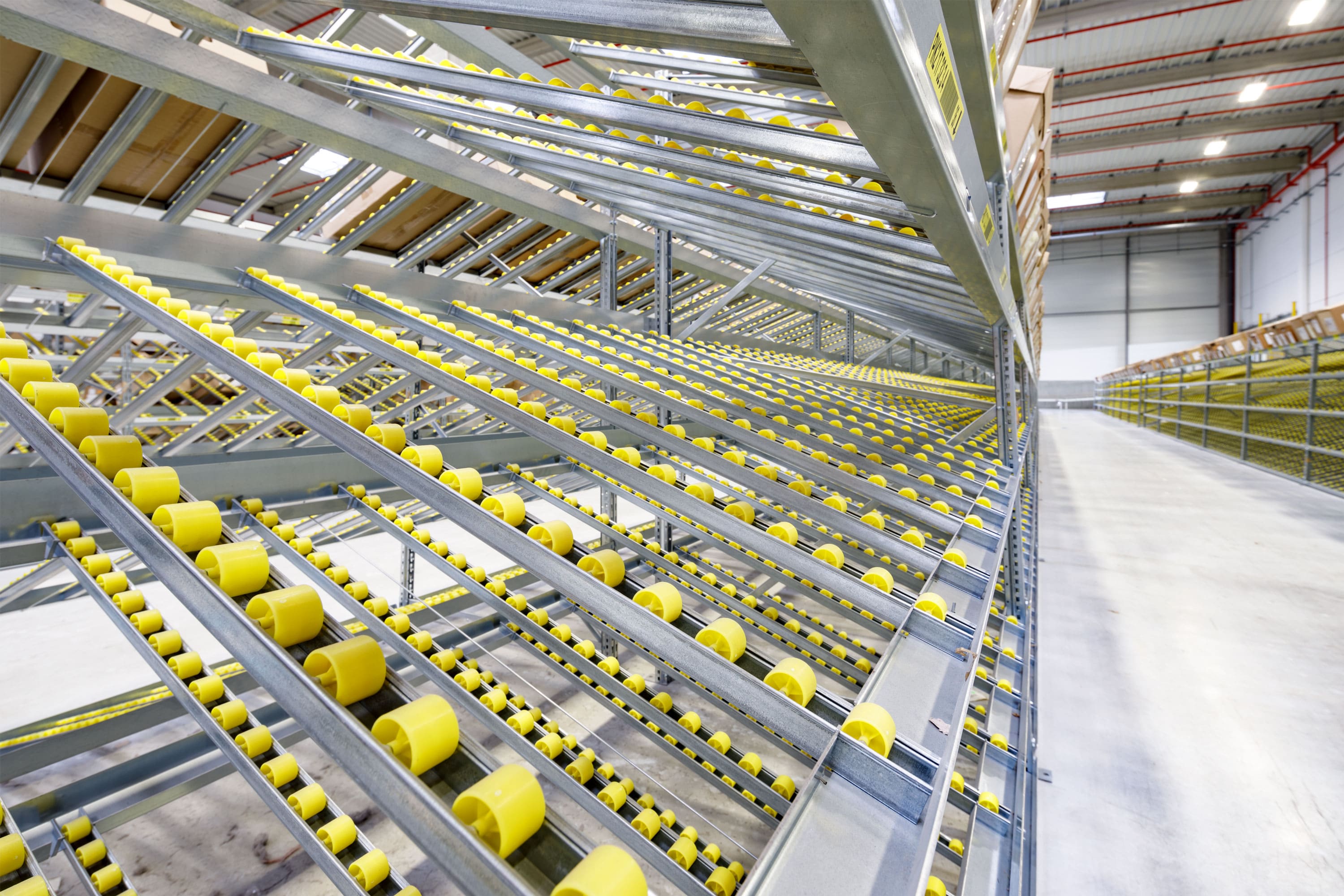 Rails à galets adaptés aux dimensions des cartons